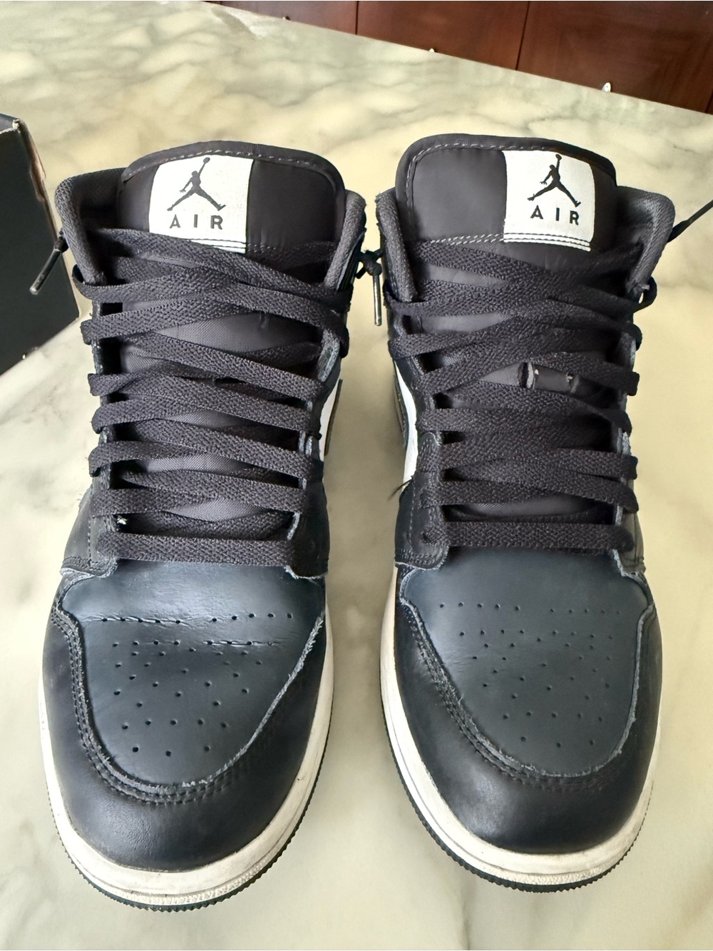Jordan Black and White Mid-Top Sneakers